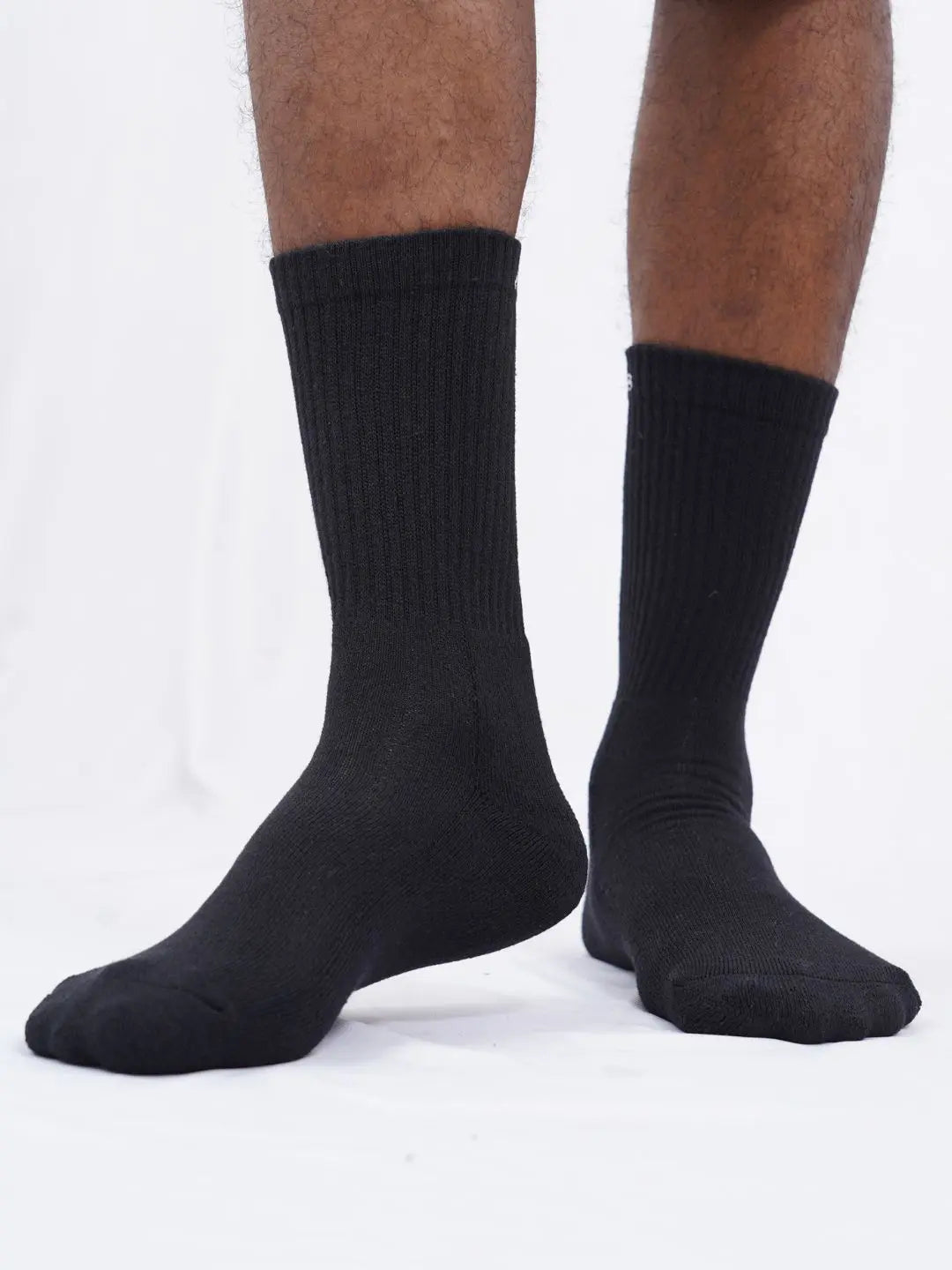 Pack of three black crew length cotton socks, designed for both men and women, featuring cushioning for all-day comfort, by Air Garb.